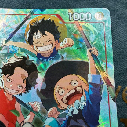 One Piece OP13-007 SR parallel figure card showing Ace, Sabo, and Luffy in PSA sleeve
