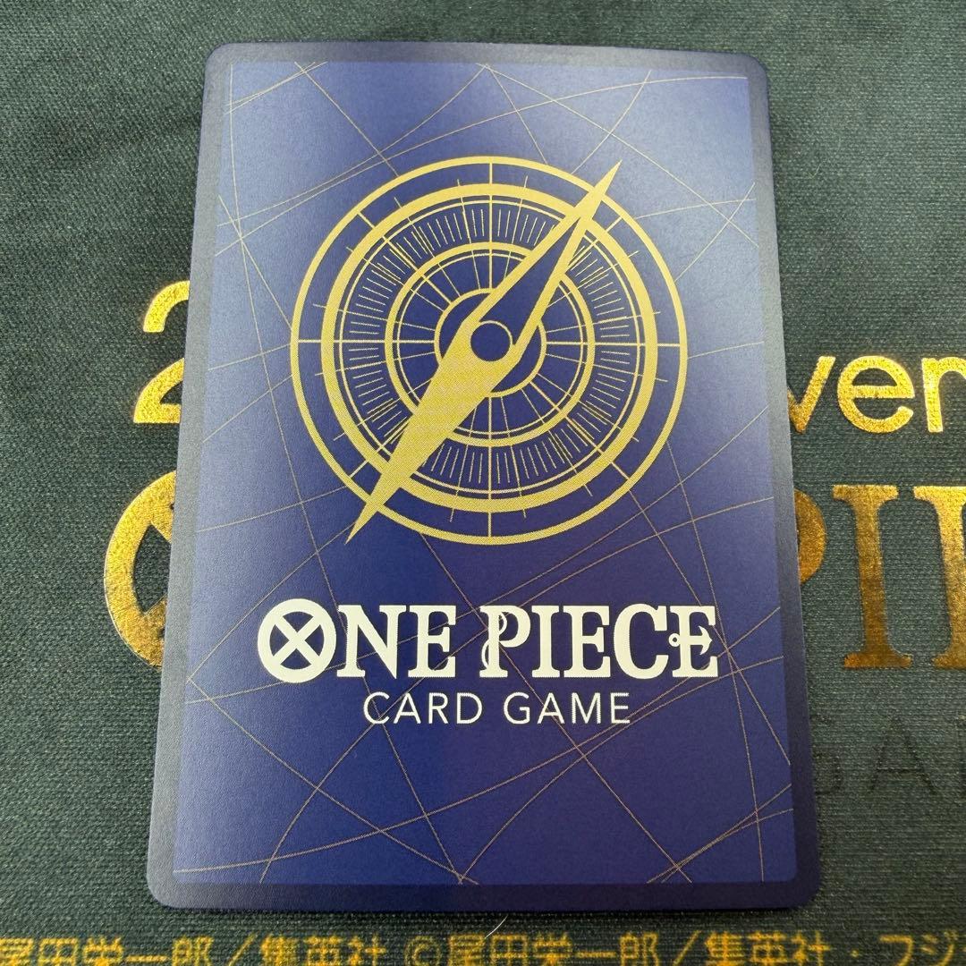 One Piece OP13-007 SR parallel figure card showing Ace, Sabo, and Luffy in PSA sleeve