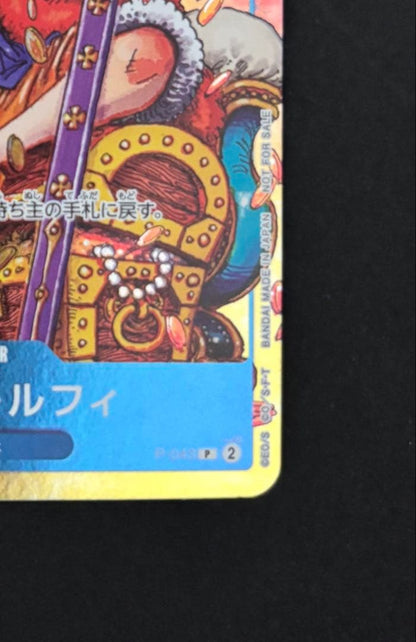 One Piece Monkey D. Luffy P-043 collectible card removed from binder with minor wear
