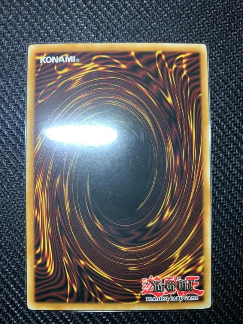 Blue Eyes White Dragon Ghost Rare hologram error Yu-Gi-Oh card with edge-overlapping hologram in protective sleeve