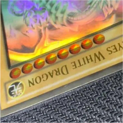 Blue Eyes White Dragon Ghost Rare hologram error Yu-Gi-Oh card with edge-overlapping hologram in protective sleeve