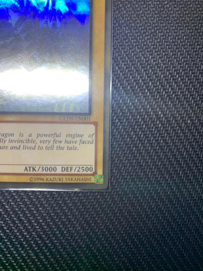 Blue Eyes White Dragon Ghost Rare hologram error Yu-Gi-Oh card with edge-overlapping hologram in protective sleeve