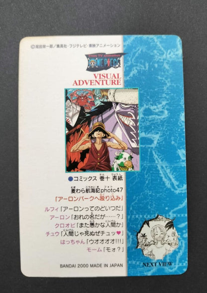 One Piece Carddass Visual Adventure 61 trading card showing Arlong Park with slight edge wear and sun fading on the back