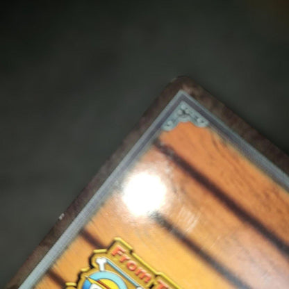 Old One Piece Monkey D. Luffy MS-C10 Pirate's Beacon trading card with signs of aging and damage