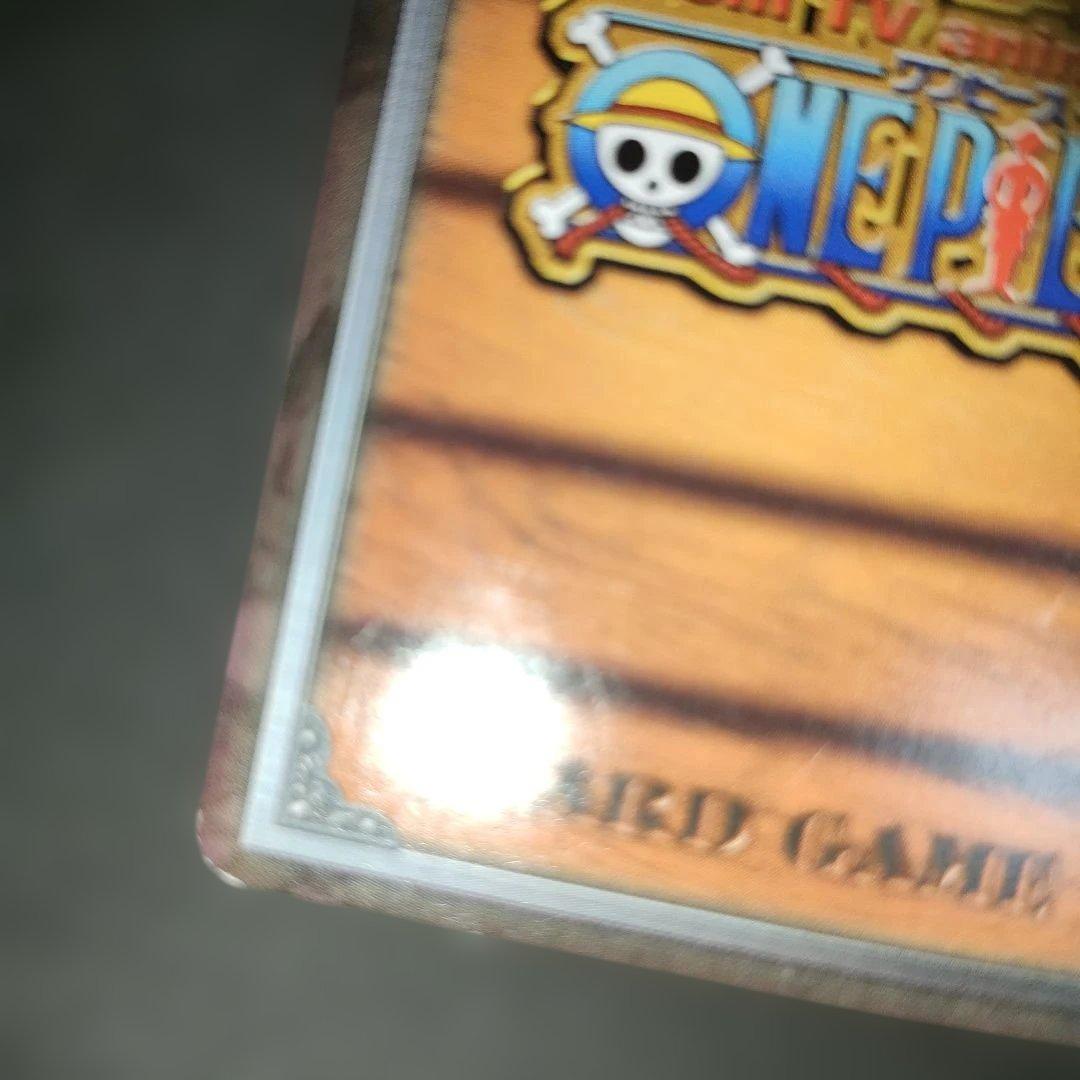 Old One Piece Monkey D. Luffy MS-C10 Pirate's Beacon trading card with signs of aging and damage