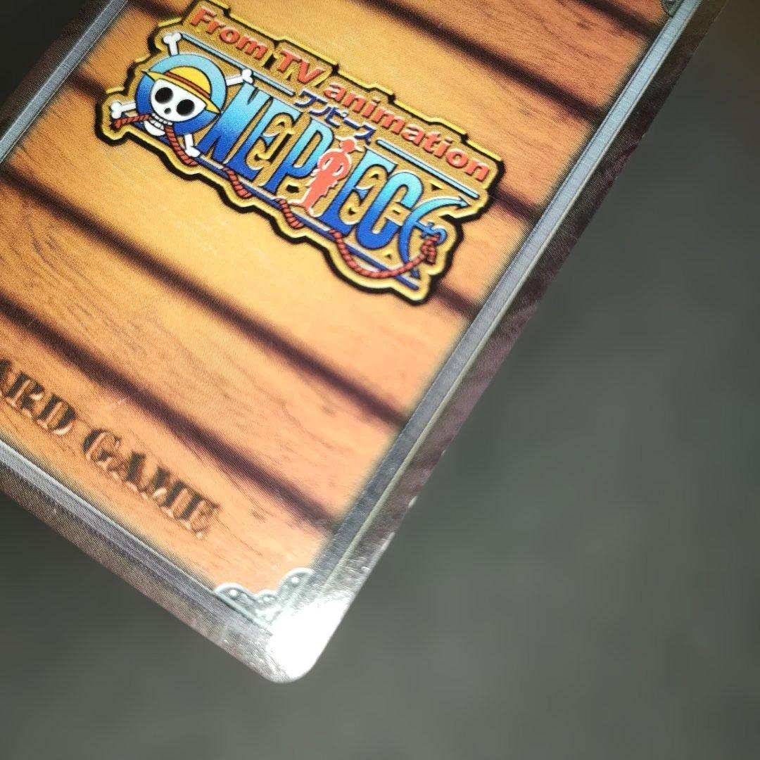 Old One Piece Monkey D. Luffy MS-C10 Pirate's Beacon trading card with signs of aging and damage