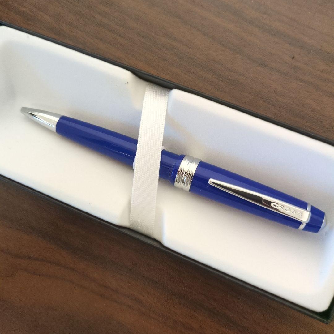 Cross ballpoint pen with vibrant blue body and silver clip featuring a simple, sophisticated design