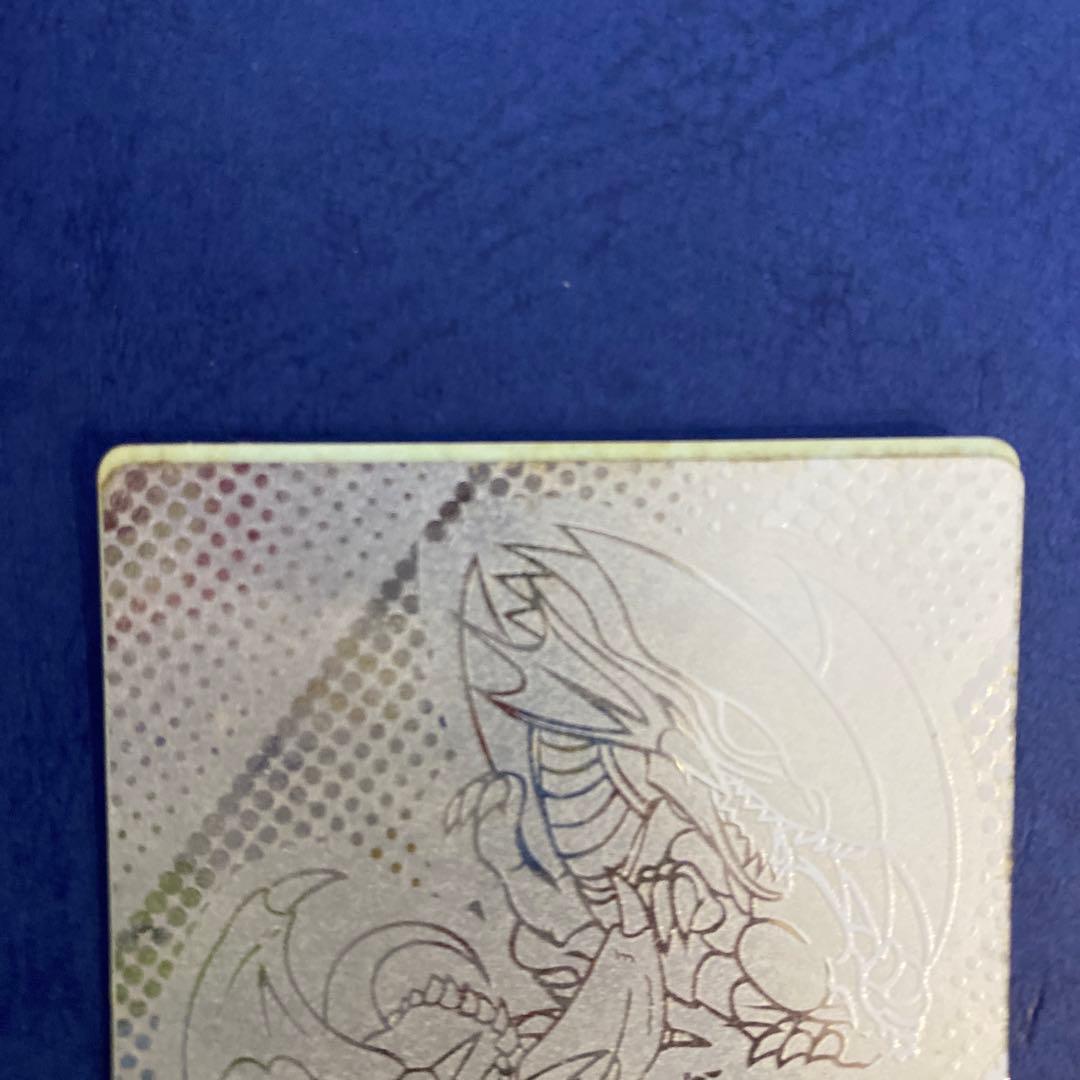 Holographic Yugioh Duel Monsters Silver Series cards with Blue-Eyes White Dragon and Dark King Rex dual-faced design