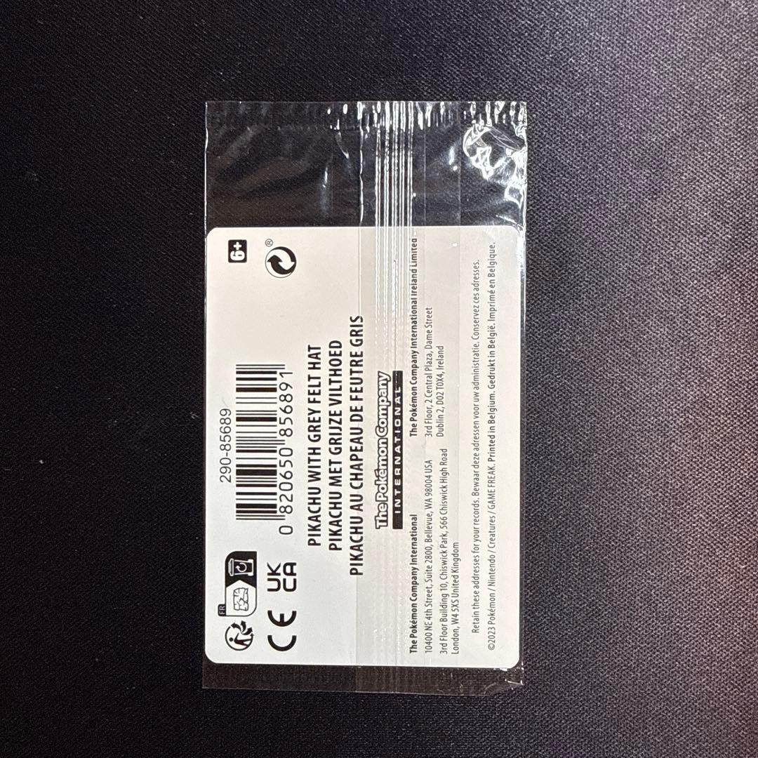 Unopened Pokemon card featuring Gogh Pikachu with grey felt hat from US Pokemon Center