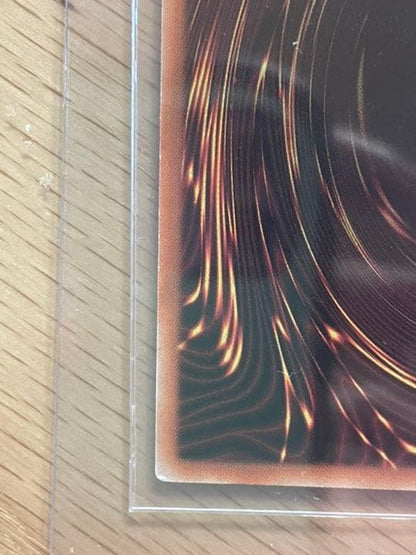 Yu-Gi-Oh Galaxy Eyes Afterglow Dragon 20th trading card with visible scratches and wear in protective loader