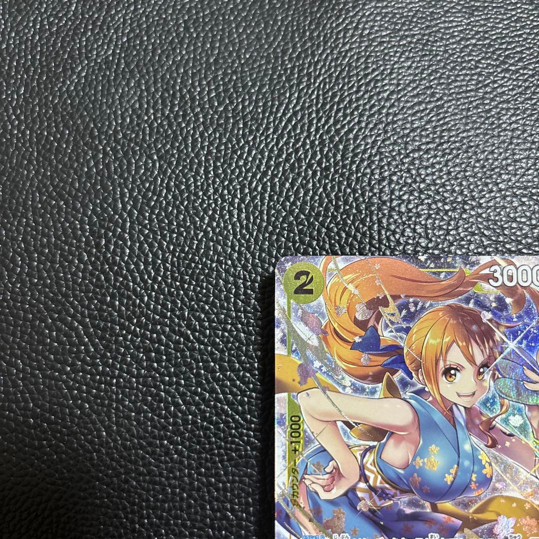 Limited edition One Piece Bandai OP06-101 R parallel trading card featuring Nami from Japan import