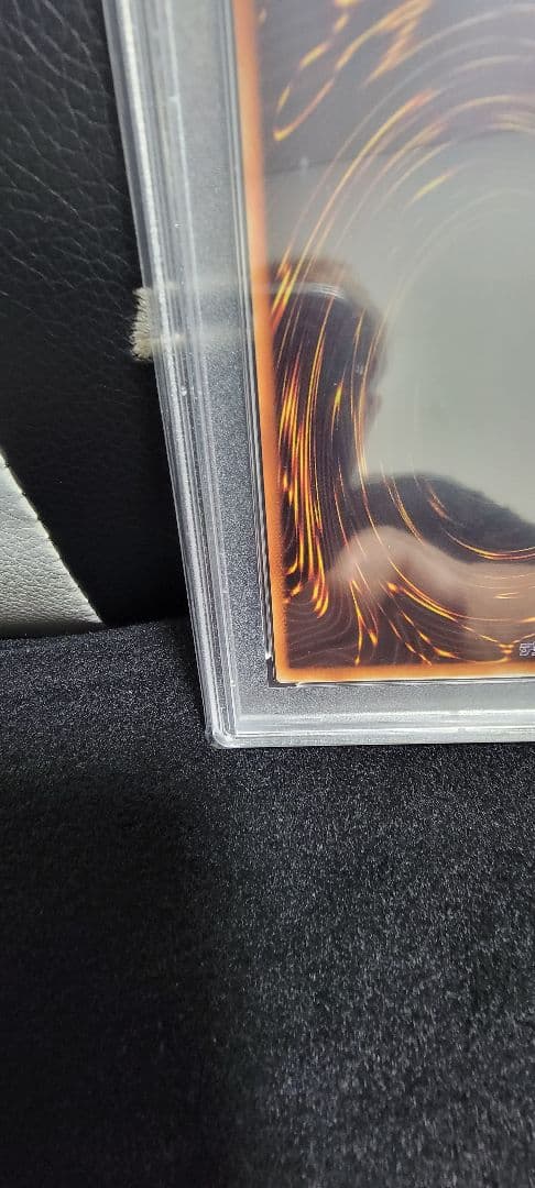 Yu-Gi-Oh! E Hero Chaos Neos Relief PSA 10 graded card with protective case showing minor scratches