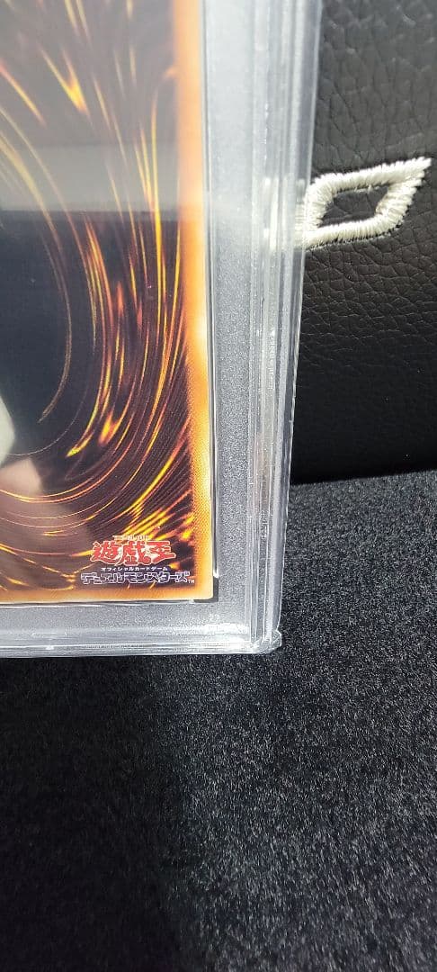 Yu-Gi-Oh! E Hero Chaos Neos Relief PSA 10 graded card with protective case showing minor scratches