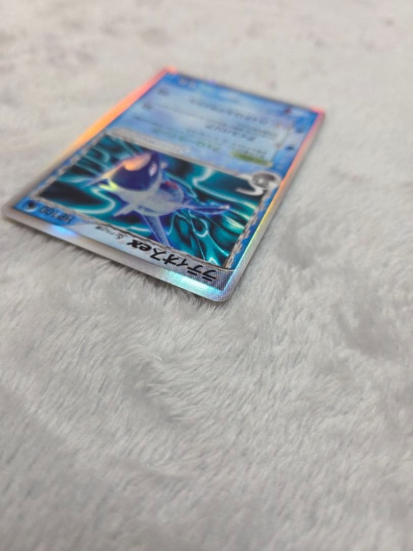 Pokemon card Delta Rayquazaex δ from 2006 Saitye no Kôbô PCG series, first edition, showing some use signs