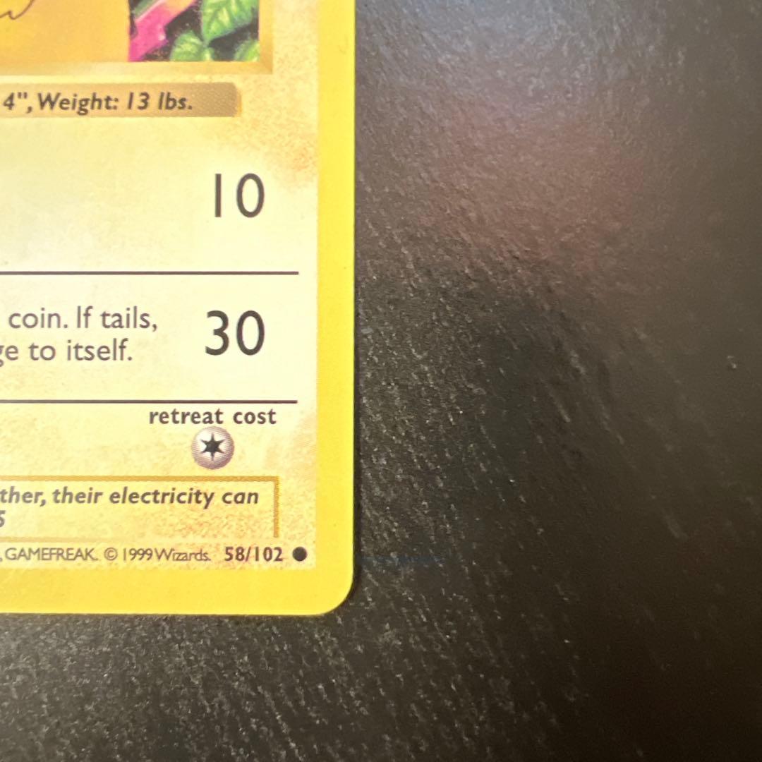 Vintage Pokemon Pikachu card 58/102 English version with minor scratches and whitening on back
