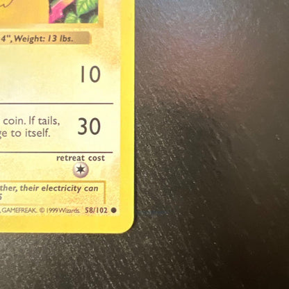 Vintage Pokemon Pikachu card 58/102 English version with minor scratches and whitening on back