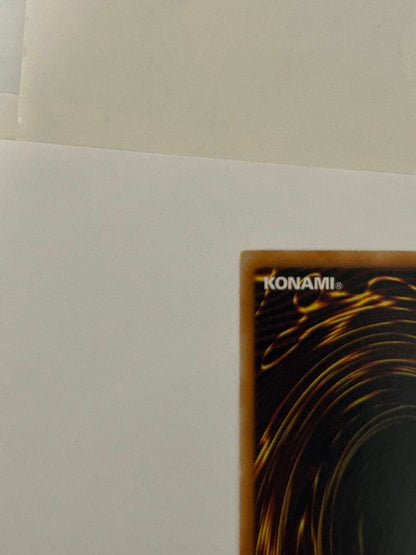 Antique Gear Golem Ultimate Rare Yu-Gi-Oh! card with worn edges and visible horizontal line on back