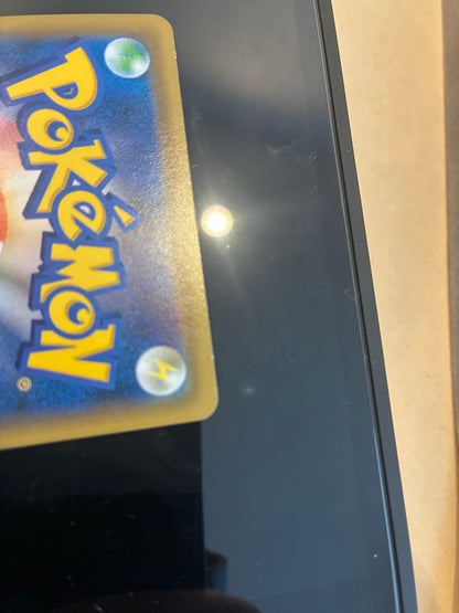 Bandai Pikachu & Zekrom GX UR Tag Team GX SM12a collectible Pokémon card in protective sleeve