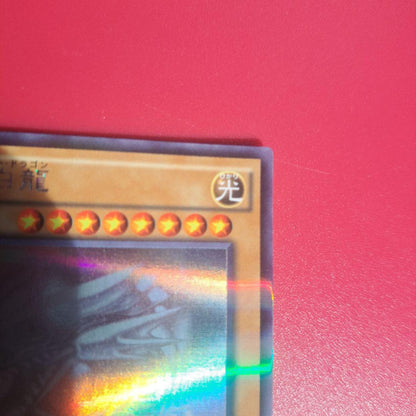 Yugioh Blue-Eyes White Dragon 20AP holographic rare card with minor scratches from Japan import