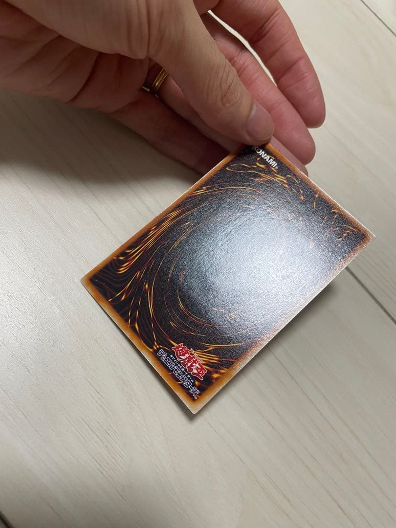 Used Yu-Gi-Oh Nephthys the Phoenix God Ultimate Rare Pleafer Card in screw-down holder with visible scratches and dirt