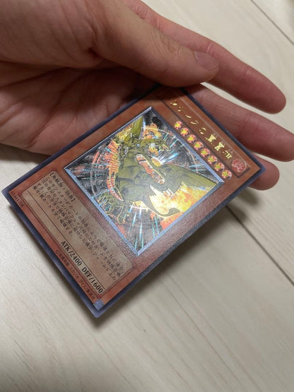 Used Yu-Gi-Oh Nephthys the Phoenix God Ultimate Rare Pleafer Card in screw-down holder with visible scratches and dirt
