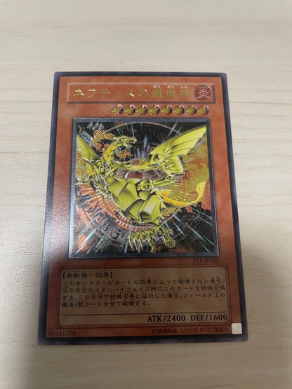 Used Yu-Gi-Oh Nephthys the Phoenix God Ultimate Rare Pleafer Card in screw-down holder with visible scratches and dirt