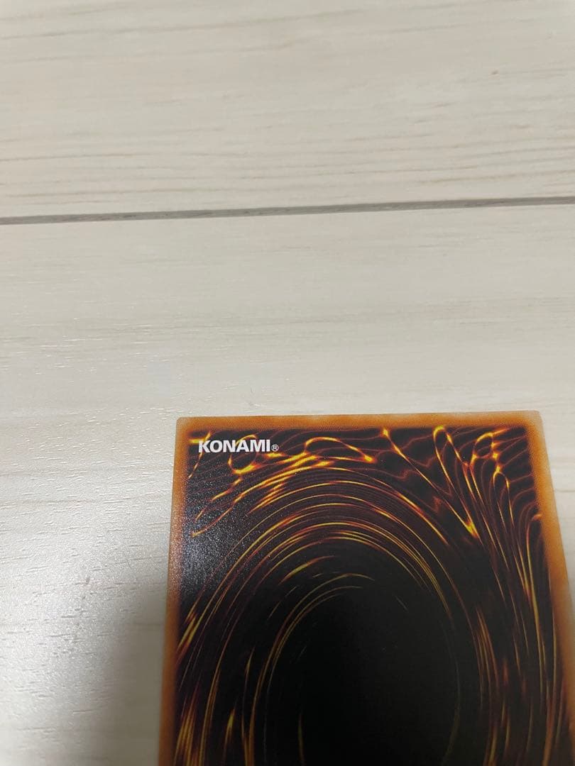 Used Yu-Gi-Oh Nephthys the Phoenix God Ultimate Rare Pleafer Card in screw-down holder with visible scratches and dirt