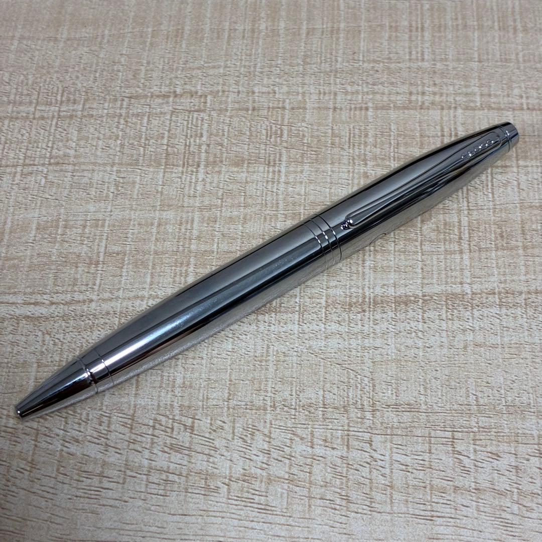 Cross brand silver ballpoint pen with matching case displayed on white background