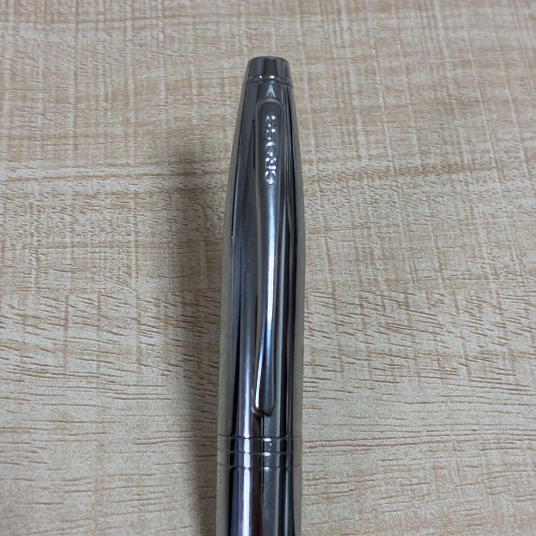 Cross brand silver ballpoint pen with matching case displayed on white background