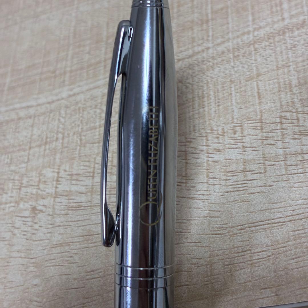 Cross brand silver ballpoint pen with matching case displayed on white background
