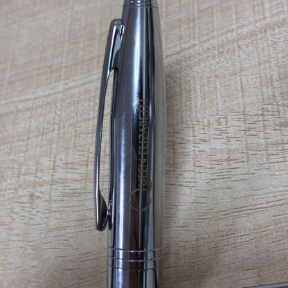 Cross brand silver ballpoint pen with matching case displayed on white background
