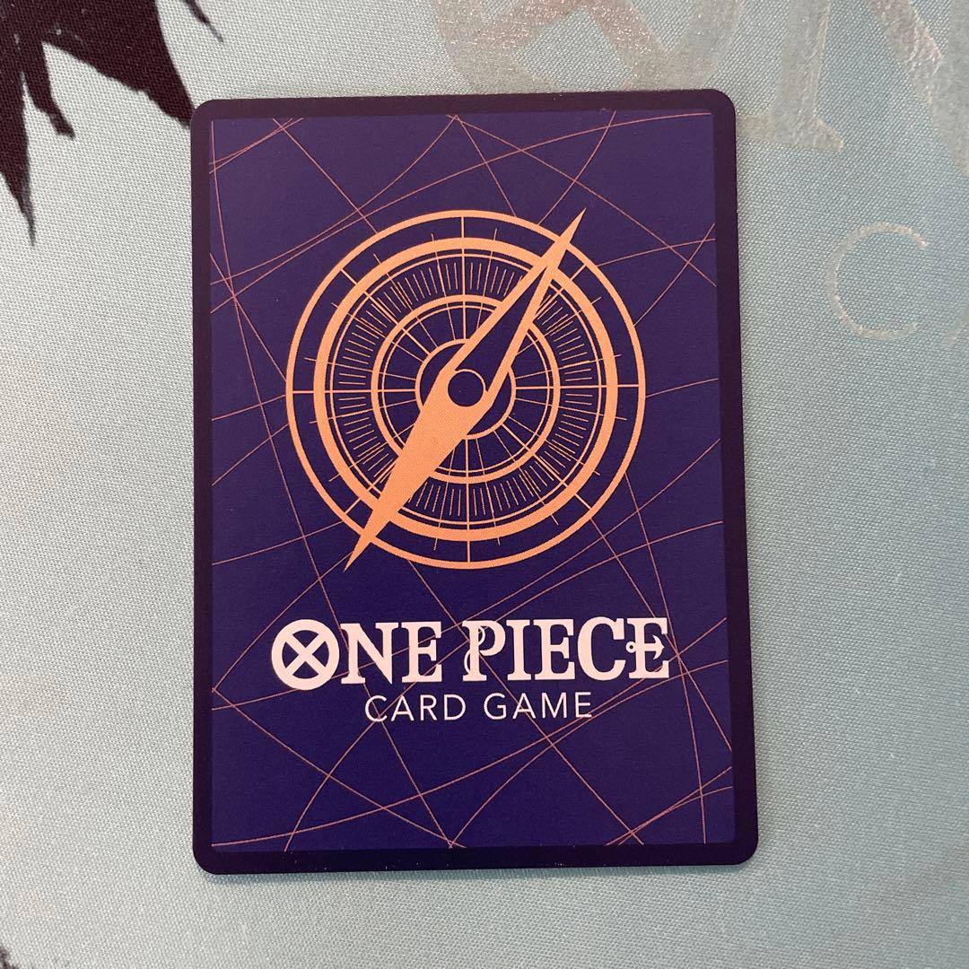 One Piece Tashigi SP EB03-018 collectible card displayed in protective sleeve