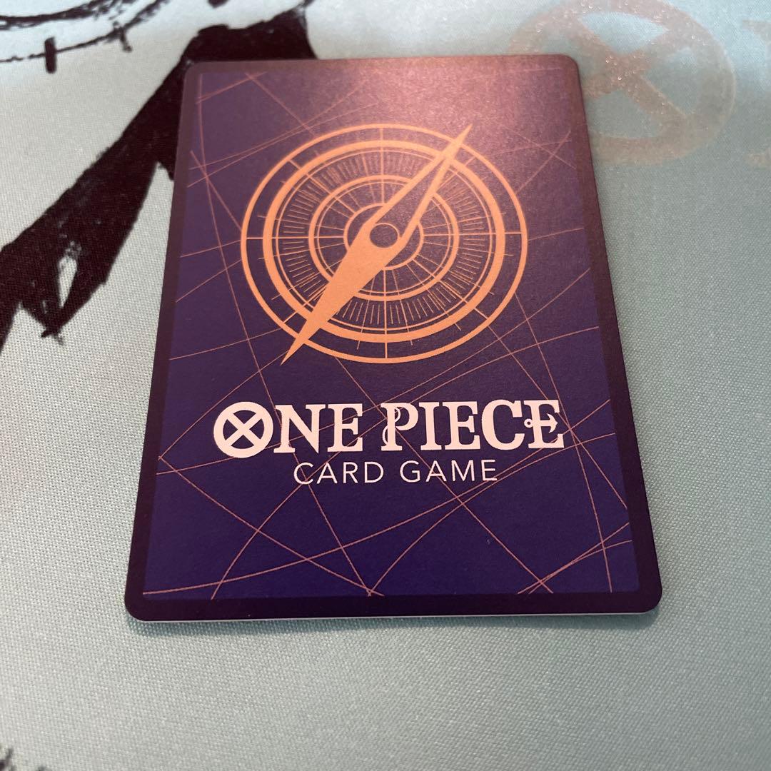 One Piece Tashigi SP EB03-018 collectible card displayed in protective sleeve
