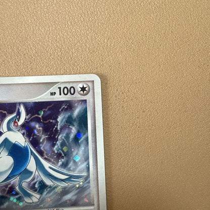 Bandai Pokémon 10th Anniversary 2007 holographic Lugia collectible card in protective sleeve