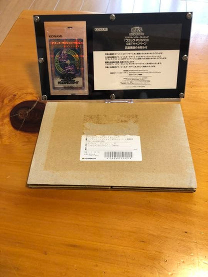 Yu-Gi-Oh Black Magician Prisma Secret Rare monster card with notification letter and screw-down holder