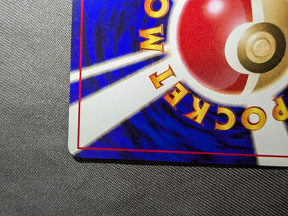 Bandai Pokemon Charizard old collectible card from the Katsura series with visible scratches and signs of storage