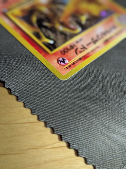 Bandai Pokemon Charizard old collectible card from the Katsura series with visible scratches and signs of storage