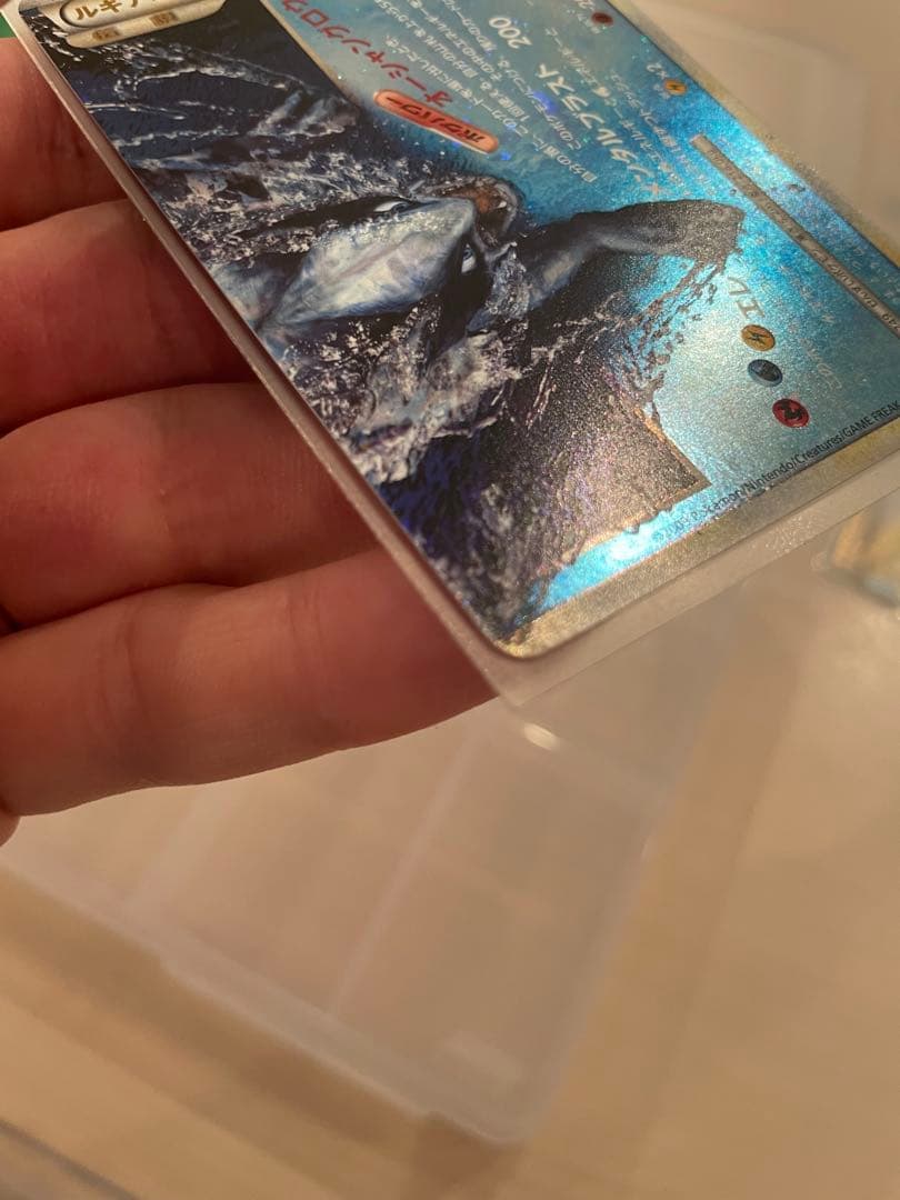 Lugia Legend first edition holographic Japanese trading card from Soul Silver collection with minor imperfections