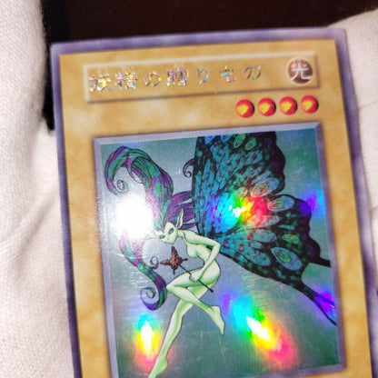 Yugioh Fairy's Gift trading card in good used condition with minor scratches