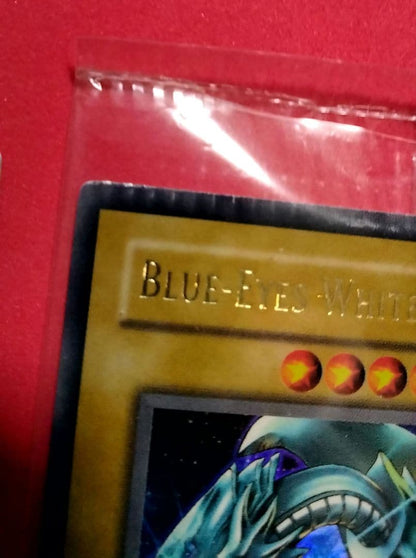 Blue-Eyes White Dragon Ultra Rare 2-card set with top-left crack error in sealed original packaging