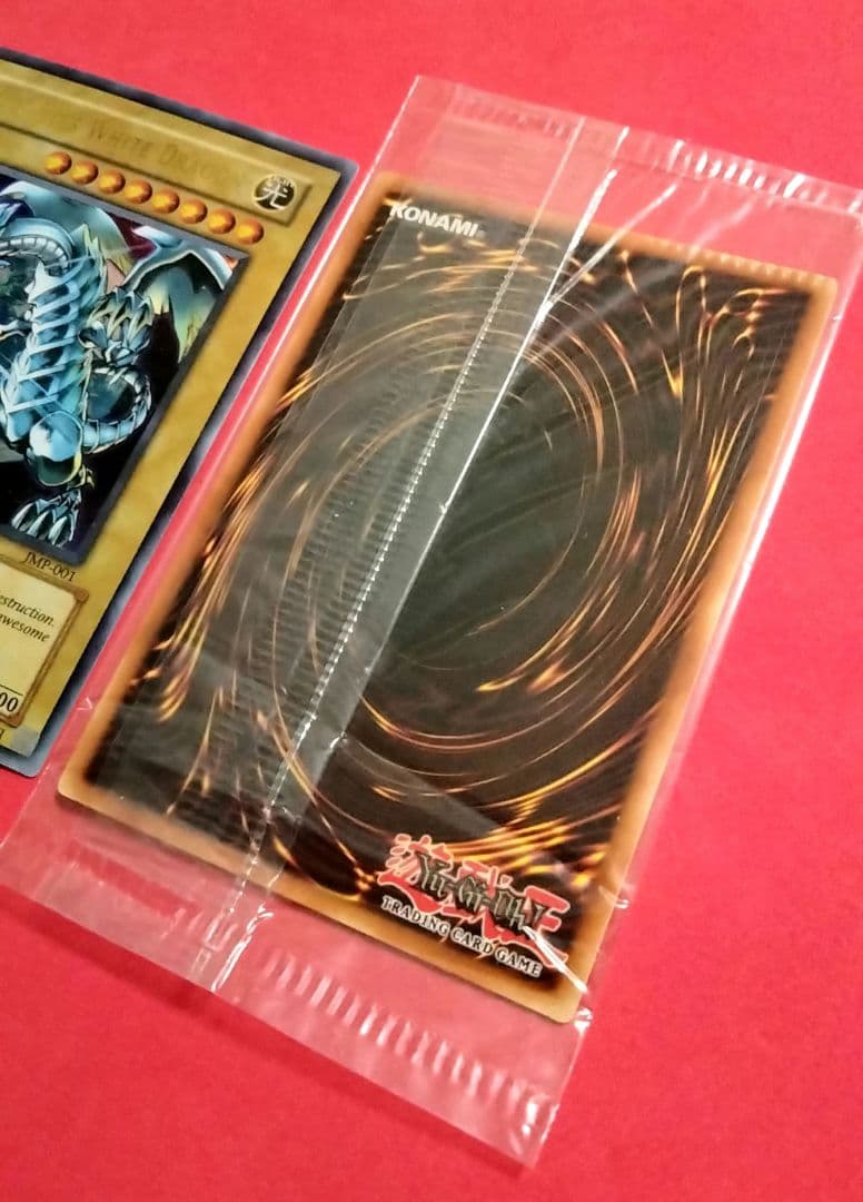 Blue-Eyes White Dragon Ultra Rare 2-card set with top-left crack error in sealed original packaging