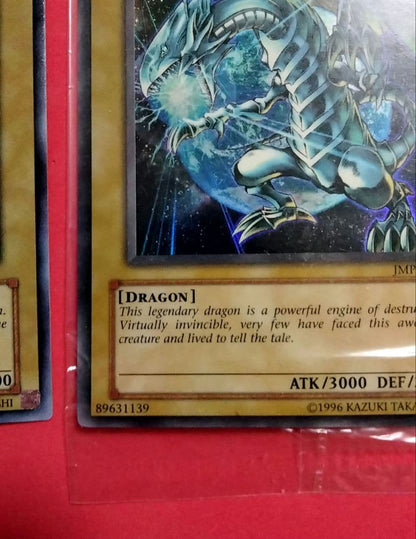 Blue-Eyes White Dragon Ultra Rare 2-card set with top-left crack error in sealed original packaging