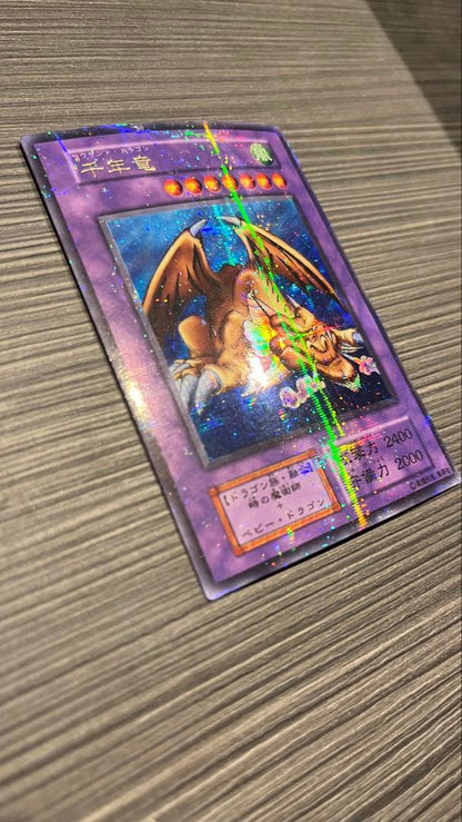 Initial edition Yugioh Millennium Dragon card from Japan with surface scratches and slight corner bend in used condition