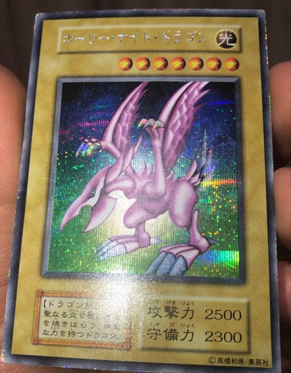 Konami Holy Night Dragon PGD-EN001 Light Attribute trading card in UV cut double sleeve with 2500 ATK and 2300 DEF