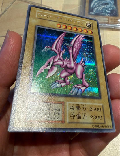 Konami Holy Night Dragon PGD-EN001 Light Attribute trading card in UV cut double sleeve with 2500 ATK and 2300 DEF