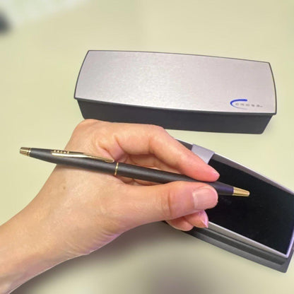 Cross ballpoint pen with matte black body and gold clip displayed with dedicated case