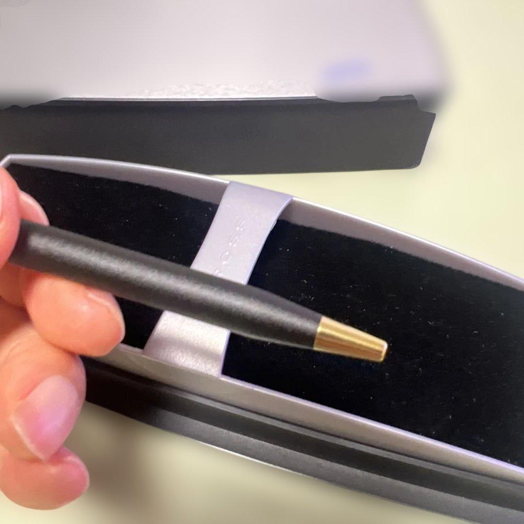 Cross ballpoint pen with matte black body and gold clip displayed with dedicated case