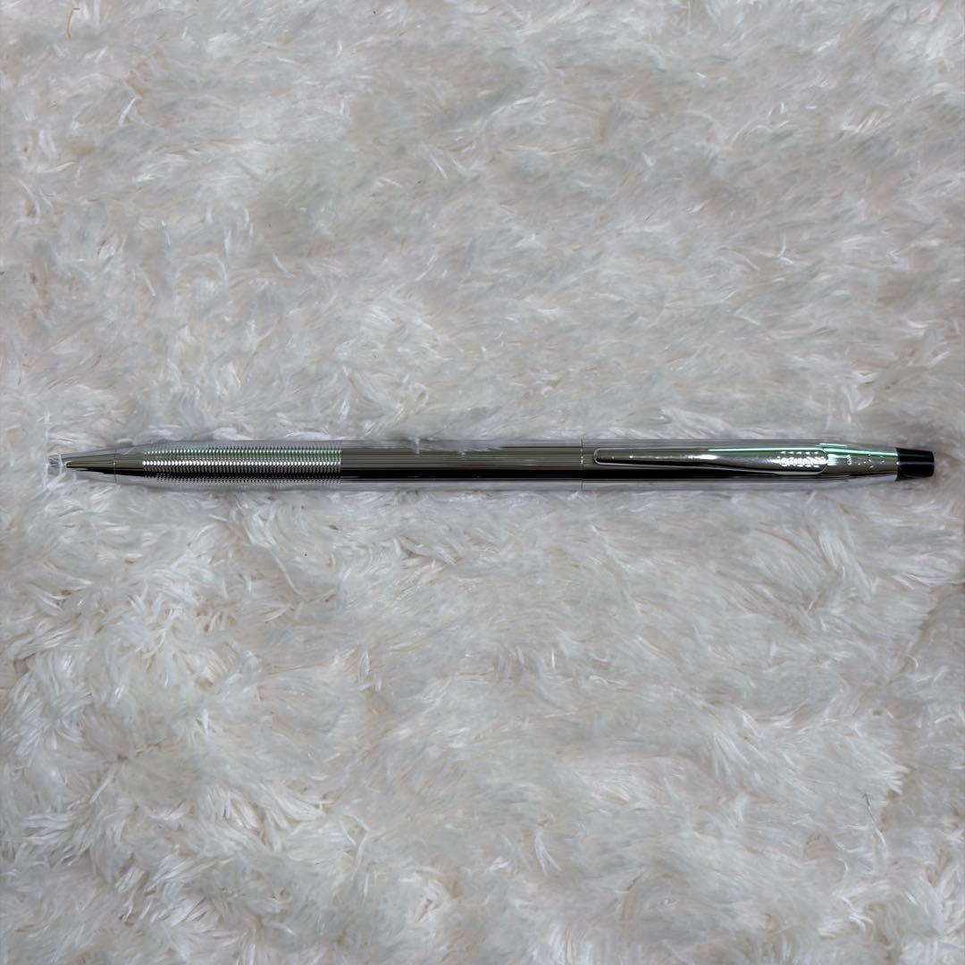 CROSS gold ballpoint pen with gold body and included box showing signs of storage wear