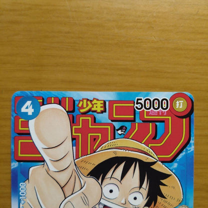 One Piece Monkey D. Luffy Jump collectible card showing white scratches and signs of wear