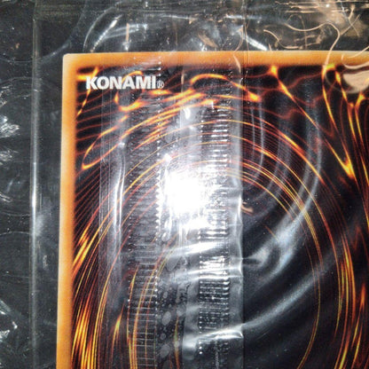 Unopened Bandai Yu-Gi-Oh official tournament winner promo card in deteriorated plastic wrapper